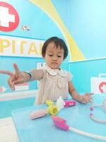 Positive activities for children playing in an indoor area filled with toy facilities and a place where they can find unlimited creativity photo