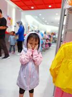 Children play in the children's playground in the mall area enjoying the holiday period, doing positive activities and having fun photo