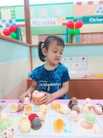 Positive activities for children playing in an indoor area filled with toy facilities and a place where they can find unlimited creativity photo