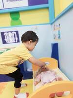 Positive activities for children playing in an indoor area filled with toy facilities and a place where they can find unlimited creativity photo