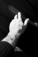 Conceptual image of hand isolated in natural light causing feeling of nostalgia photo