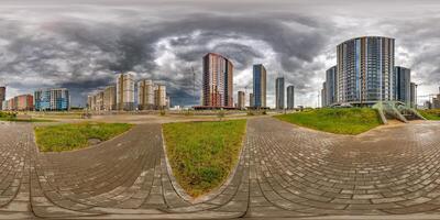 hdri 360 panorama on pedestrian road in elite residential complex with skyscrapers before rain or after storm with black sky and dark clouds in full equirectangular seamless spherical projection photo