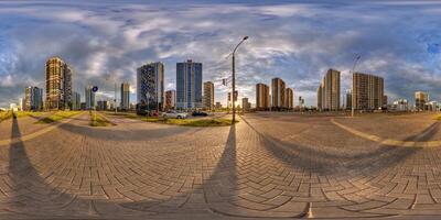 hdri 360 panorama on pedestrian road near new skyscrapers and residential complex after rain and storm before sunset in full equirectangular seamless spherical projection photo