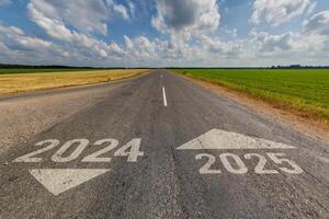 numbers 2024, 2025 on asphalt road highway. concept of destination in future, freedom, work start, run, planning, challenge, target, go, start, new year photo