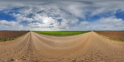 blue sky hdri 360 panorama with awesome clouds on gravel road among fields in spring day in equirectangular full seamless spherical projection, for VR AR content or skydome replacement photo