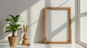 Mockup of wood border thin frame with rabbit sculpture next to it. photo