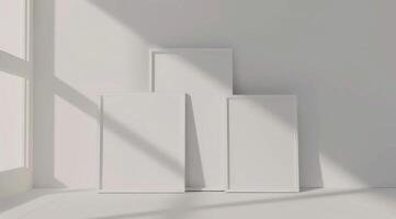 Front view of three white minimalistic picture frames on a light background. photo