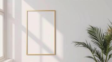 A thin gold frame on a white wall. photo