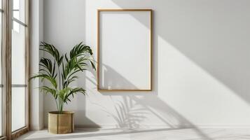 A thin gold frame on a white wall. photo