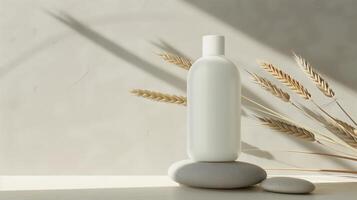 A bottle of skincare product on the top of large stones stacked together. photo