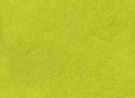 light green Nepalese Lokta paper texture. Seamless handmade craft recycled watercolor background surface page sheet for calligraphy artwork. Fuego, Wattle, Bahia, Rio Grande, Earls Green colors. photo