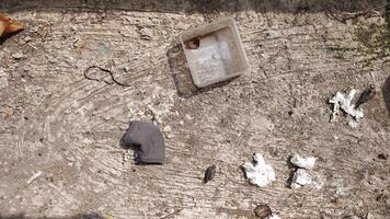 The ground surface is full of plastic and tissue waste accompanied by dust that sticks to the floor. very suitable for campaign backgrounds photo