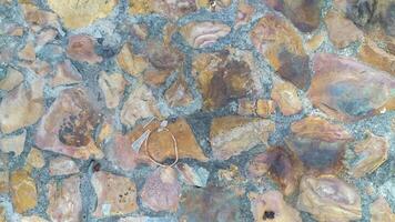 photo of a tile material texture made from chunks of stone of different sizes and colors creating a distinctive shape