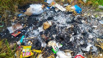 a pile of garbage and trash on the ground photo