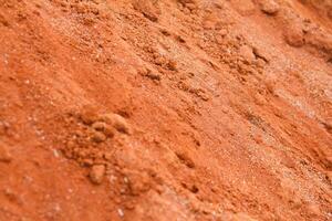 Red clay used as a handicraft material, clay background photo