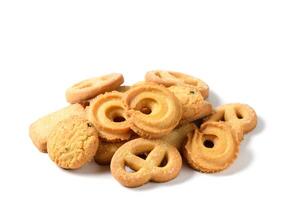 Set of danish butter cookies macro cutout. Five whole pretzel, round and rectangular shortbread biscuits with sugar on white background photo