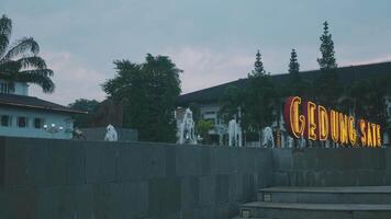Gedung Sate at dusk with illuminated signage video