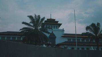 Historic building with traditional architecture and palm trees video