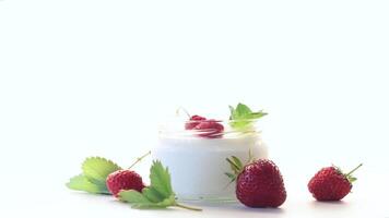 homemade sweet yogurt in a jar with strawberries, isolated on white background video