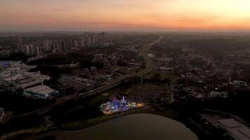 Curitiba in Parana, Brazil. Aerial View. Wonderful sunset with views of buildings and Tangua Park. Lake with reflection. video