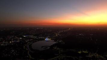 Curitiba in Parana, Brazil. Aerial View. Wonderful sunset with views of buildings and Tangua Park. Lake with reflection. video