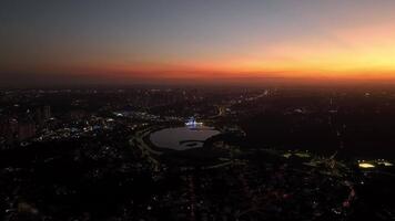 Curitiba in Parana, Brazil. Aerial View. Wonderful sunset with views of buildings and Tangua Park. Lake with reflection. video