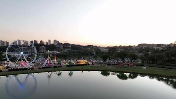 Curitiba in Parana, Brazil. Aerial View. Wonderful sunset with views of buildings and Tangua Park. Lake with reflection. video
