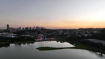 Curitiba in Parana, Brazil. Aerial View. Wonderful sunset with views of buildings and Tangua Park. Lake with reflection. video