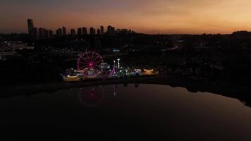Curitiba in Parana, Brazil. Aerial View. Wonderful sunset with views of buildings and Tangua Park. Lake with reflection. video