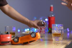Alcoholic drinks were in goblets and placed on tables within party. Alcohol was consumed by drinkers within party before departed. drinking alcohol in moderation and campaigning against drunk driving. photo