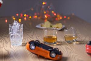 Alcoholic drinks were in goblets and placed on tables within party. Alcohol was consumed by drinkers within party before departed. drinking alcohol in moderation and campaigning against drunk driving. photo
