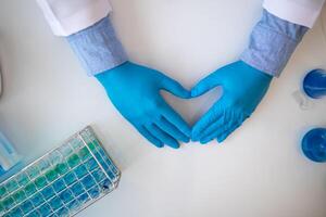 The heart symbol in the hand of a doctor is a symbol of the campaign to care for the health of heart disease patients and to encourage people at risk of heart disease to come for regular check-ups. photo