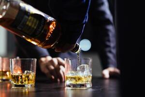 glass of alcohol is left on table after drinking with friends in office after work so that alcohol helps relax mind drinking alcohol in moderation and campaigning against drunk driving. photo