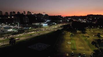Curitiba in Parana, Brazil. Aerial View. Wonderful sunset with views of buildings and Tangua Park. Lake with reflection. video