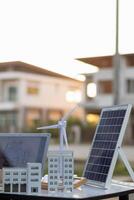 Engineers are reviewing plans from architects to prepare to install solar panels and wind turbines on the building to efficiently produce electricity using the concept of green energy from solar cells photo
