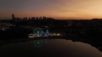 Curitiba in Parana, Brazil. Aerial View. Wonderful sunset with views of buildings and Tangua Park. Lake with reflection. video