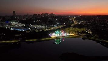 Curitiba in Parana, Brazil. Aerial View. Wonderful sunset with views of buildings and Tangua Park. Lake with reflection. video