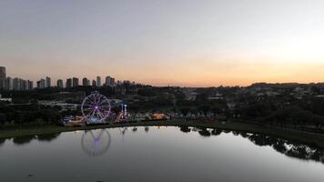 Curitiba in Parana, Brazil. Aerial View. Wonderful sunset with views of buildings and Tangua Park. Lake with reflection. video