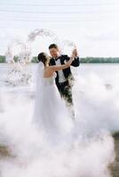 the first dance of the bride and groom inside a restaurant photo