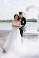 the first dance of the bride and groom inside a restaurant photo