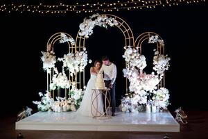 newlyweds happily cut and taste the wedding cak photo