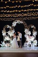 newlyweds happily cut and taste the wedding cak photo