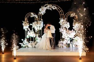 newlyweds happily cut and taste the wedding cak photo