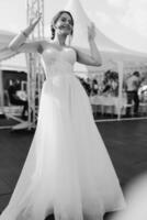 the first dance of the bride and groom inside a restaurant photo