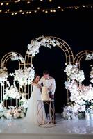 newlyweds happily cut and taste the wedding cak photo