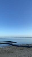 Floating Dock on Calm Ocean at Sunset photo