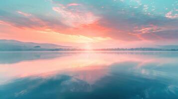 A beautiful, serene lake with a pink and purple sky in the background photo