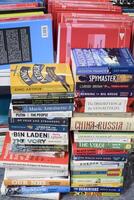 New Delhi, India, June 17 2024 - Variety of Books on shelf inside a book-stall at Delhi International Book Fair, Selection of books on display in Annual Book Fair at Bharat Mandapam complex photo