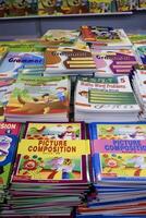 New Delhi, India, June 17 2024 - Variety of Books on shelf inside a book-stall at Delhi International Book Fair, Selection of books on display in Annual Book Fair at Bharat Mandapam complex photo