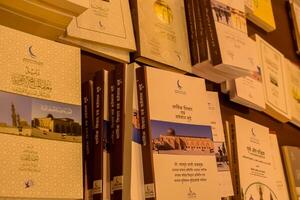 New Delhi, India, June 17 2024 - Variety of Books on shelf inside a book-stall at Delhi International Book Fair, Selection of books on display in Annual Book Fair at Bharat Mandapam complex photo
